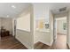 Upstairs hallway features hardwood floors, natural light, and neutral paint at 3235 Avondale Pkwy, Powder Springs, GA 30127