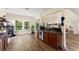Open concept kitchen with wood floors and breakfast bar, creating a functional and stylish space at 3235 Avondale Pkwy, Powder Springs, GA 30127
