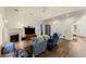 Cozy living room with fireplace, hardwood floors, and comfortable seating, ideal for Gathering gatherings at 3235 Avondale Pkwy, Powder Springs, GA 30127