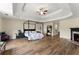 This main bedroom boasts hardwood floors, tray ceilings, and plenty of open space at 3235 Avondale Pkwy, Powder Springs, GA 30127
