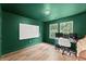 Office features great natural lighting, hardwood floors, and a white board at 3235 Avondale Pkwy, Powder Springs, GA 30127