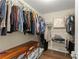 Organized walk-in closet featuring custom shelving, hardwood floors and ample storage space at 3235 Avondale Pkwy, Powder Springs, GA 30127