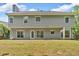 Spacious backyard featuring a large green lawn and view of the home's exterior at 5705 Cannonero Dr, Alpharetta, GA 30005