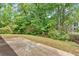Backyard with a patio and lush greenery at 5705 Cannonero Dr, Alpharetta, GA 30005