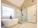 Primary bathroom offers a freestanding soaking tub with a glass-enclosed shower at 5705 Cannonero Dr, Alpharetta, GA 30005