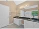 Primary bath featuring double sinks, large mirror, vanity lighting, and a shower at 5705 Cannonero Dr, Alpharetta, GA 30005