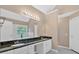 Primary bathroom featuring double sinks, large mirror, vanity lighting, soaking tub and a shower at 5705 Cannonero Dr, Alpharetta, GA 30005