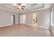 Bedroom featuring large windows, fan, and doorways at 5705 Cannonero Dr, Alpharetta, GA 30005