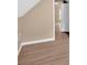 Neutral bedroom with wood-look flooring and white trim, leads to other rooms at 5705 Cannonero Dr, Alpharetta, GA 30005