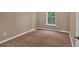 Comfortable bedroom with a ceiling fan, a window providing natural light, and wood laminate flooring at 5705 Cannonero Dr, Alpharetta, GA 30005