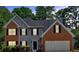 Charming two-story home with brick and siding, black shutters, and a well-manicured lawn at 5705 Cannonero Dr, Alpharetta, GA 30005