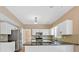 Well-equipped kitchen boasts stainless steel appliances, granite countertops, and ample cabinet space at 5705 Cannonero Dr, Alpharetta, GA 30005