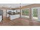 Bright eat-in kitchen area with a door to the outside and bar seating at the counter at 5705 Cannonero Dr, Alpharetta, GA 30005
