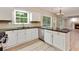 Kitchen featuring white cabinets, stainless steel appliances, and granite countertops at 5705 Cannonero Dr, Alpharetta, GA 30005