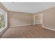 Spacious living room with wood floors, neutral walls, and large windows for plenty of natural light at 5705 Cannonero Dr, Alpharetta, GA 30005