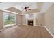 Cozy living room features a fireplace and views of the outdoors from the window at 5705 Cannonero Dr, Alpharetta, GA 30005