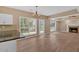 Open-concept living room with a fireplace, large windows, and seamless flow to the kitchen at 5705 Cannonero Dr, Alpharetta, GA 30005