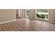 Open living area boasting new hardwood floors, fresh paint, and natural light at 5705 Cannonero Dr, Alpharetta, GA 30005