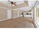Open floor plan with views of the kitchen featuring wood floors, fireplace and natural light at 5705 Cannonero Dr, Alpharetta, GA 30005