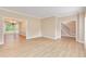 Bright and airy living room featuring hardwood floors and views to the dining room at 5705 Cannonero Dr, Alpharetta, GA 30005