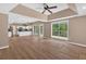 Open floor plan with natural light and a view into the kitchen and dining areas at 5705 Cannonero Dr, Alpharetta, GA 30005