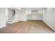 Finished basement featuring laminate flooring and built-in shelving at 1780 Kinridge Rd, Marietta, GA 30062