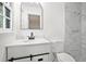Renovated bathroom featuring a modern vanity, toilet, and tiled shower at 1780 Kinridge Rd, Marietta, GA 30062