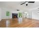 Bright living room with hardwood floors, brick fireplace, and sliding glass doors at 1780 Kinridge Rd, Marietta, GA 30062
