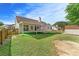 Large backyard with a covered patio and storage shed at 2620 Matlin Way, Buford, GA 30519