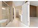 Bathroom with a glass shower and leads to a walk-in closet and bedroom, promoting convenience at 2620 Matlin Way, Buford, GA 30519
