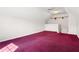 Spacious bedroom featuring red carpet, bright walls, and a stairwell at 2620 Matlin Way, Buford, GA 30519