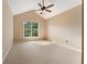 Bedroom featuring plush carpet, neutral paint, ceiling fan and large window at 2620 Matlin Way, Buford, GA 30519