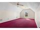 Bright bedroom with red carpet, ceiling fan, and natural light from a window at 2620 Matlin Way, Buford, GA 30519