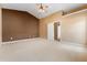 Large bedroom featuring a contrasting accent wall and multiple doorways, for a striking design at 2620 Matlin Way, Buford, GA 30519
