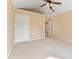Spacious bedroom features a ceiling fan and neutral paint, perfect for relaxation and personalization at 2620 Matlin Way, Buford, GA 30519