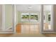 View of a bright sitting room with hardwood flooring and a view to the backyard at 2620 Matlin Way, Buford, GA 30519