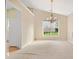Living room features plush carpeting, neutral paint, and large window for ample natural light at 2620 Matlin Way, Buford, GA 30519