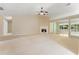 Spacious living room featuring a cozy fireplace and lots of natural light through large windows at 2620 Matlin Way, Buford, GA 30519