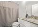 Cozy bathroom featuring a granite countertop, a toilet, and a shower featuring a shower curtain ensuring comfort and practicality at 3298 Alcovy Club Ct, Dacula, GA 30019