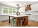 A well-appointed kitchen features a large island and lots of natural light at 3298 Alcovy Club Ct, Dacula, GA 30019