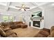 Comfortable living room featuring a fireplace, coffered ceiling, and a sectional sofa at 3298 Alcovy Club Ct, Dacula, GA 30019