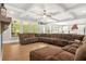 Bright living room with a fireplace, coffered ceiling, and an open view to the kitchen at 3298 Alcovy Club Ct, Dacula, GA 30019