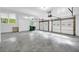 Large basement garage with two garage door bays, windows and a concrete floor at 4331 E Kings Point Circle, Dunwoody, GA 30338