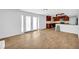 Basement with vinyl flooring, white walls, and a partial kitchen with dark wood cabinets at 4331 E Kings Point Circle, Dunwoody, GA 30338