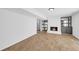 Cozy basement living space featuring vinyl flooring and a painted brick fireplace with storage at 4331 E Kings Point Circle, Dunwoody, GA 30338