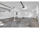 Spacious basement with concrete floor and white walls, offering ample storage or recreational space at 4331 E Kings Point Circle, Dunwoody, GA 30338