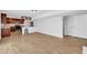Basement featuring luxury vinyl flooring, white walls, and a partial kitchen with dark wood cabinets at 4331 E Kings Point Circle, Dunwoody, GA 30338