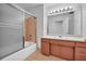 Classic-style bathroom with tub, vanity, mirrored wall, and cabinets at 4331 E Kings Point Circle, Dunwoody, GA 30338