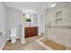 Well-lit bathroom with a tiled shower, modern toilet, and vanity with granite countertops at 4331 E Kings Point Circle, Dunwoody, GA 30338