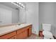 Well-maintained bathroom with vanity, commode, mirror, and tile flooring at 4331 E Kings Point Circle, Dunwoody, GA 30338